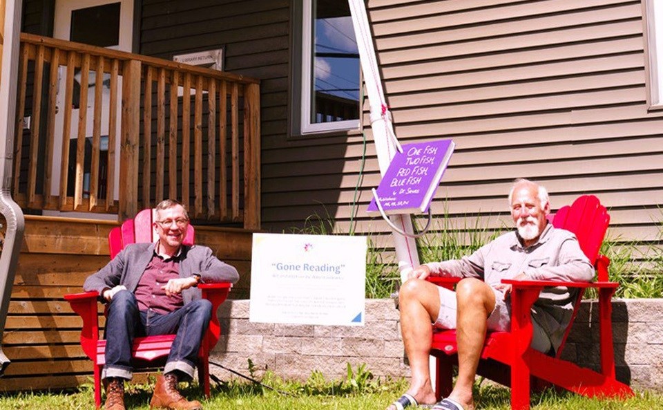 Albert Gilewicz (right) created the 10-metre tall fishing rod that is now anchored to the Whitestone Public Library and Technology Centre. Also pictured is local library board member Josh Davis who officiated the unveiling of the giant fishing pole.
