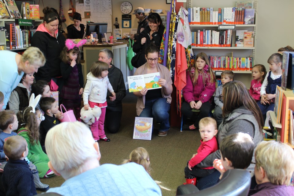 Madison Kerr reading for Toddler Tales at the Library to demonstrate the need for space.