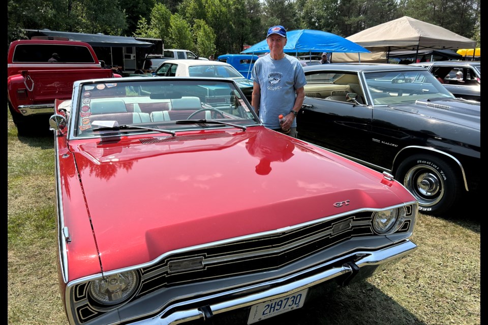 Tom Thomson Park, South River, Car Show. Norm Goring stands proudly next to his Dodge Dart.