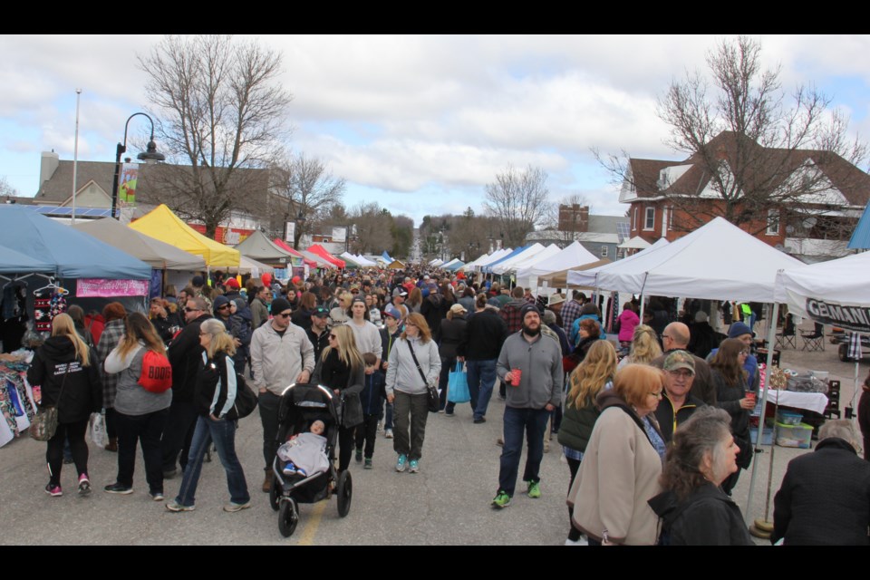 
Main Street Powassan packed with people attending the annual Powassan Maple Syrup Festival 
File Photo by Jeff Turl.