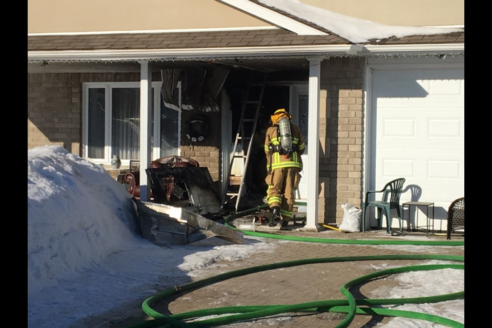 A firefighter enters the Kingsway Avenue this morning.   Photo by Chris Dawson/BayToday.ca 