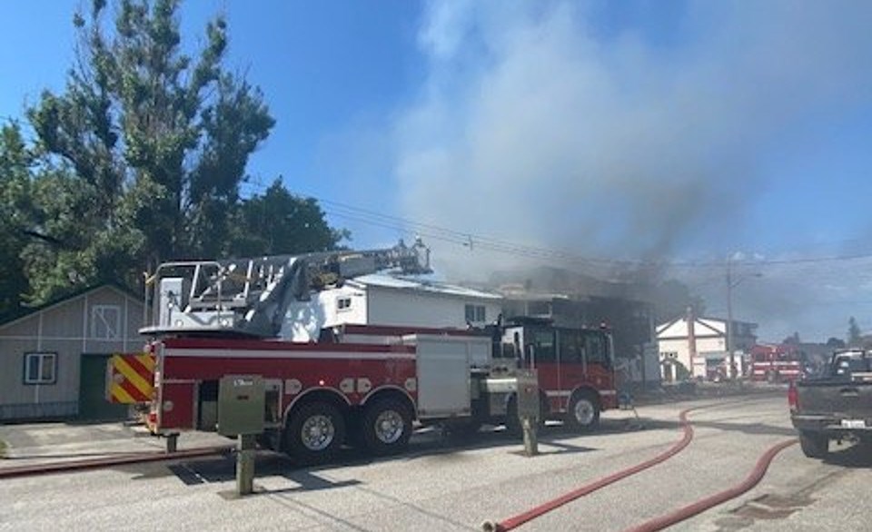 Firefighters battle the fire in Sturgeon Falls.  Photo courtesy Facebook. 