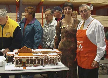 Angela Johnston with Mayor Fedeli next to Gingerbread Depot.