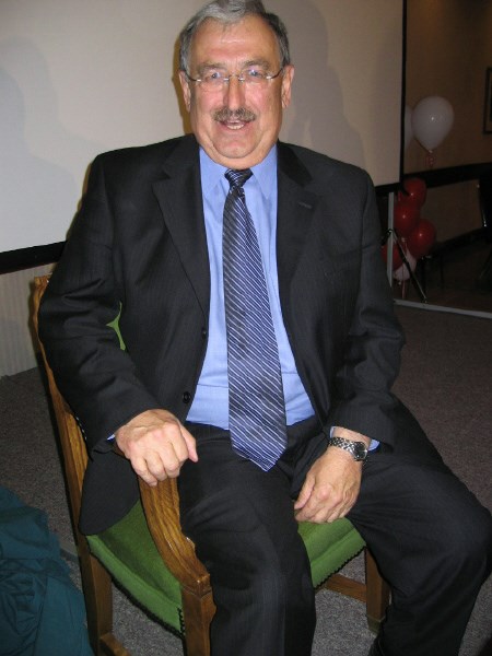 Bob Wood poses in a chair given to him as a present. The chair is the one he sat in in the House of Commons for almost 16 years.