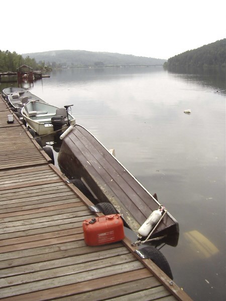 <b>An overturned boat floats next to the dock at the Mattawa Adventure Camp. Photo by Yanka, courtesy of Mattawa Adventure Camp, Special to BayToday.ca.</b>