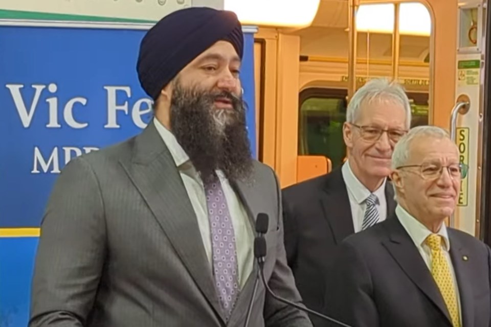 Minister of Transportation Prabmeet Sarkaria announces a $350-million deal for North Bay's Ontario Northland Remanufacturing and Repair Centre to refurbish GO trains as MPP Vic Fedeli (far right) and North Bay Mayor Peter Chirico look on.