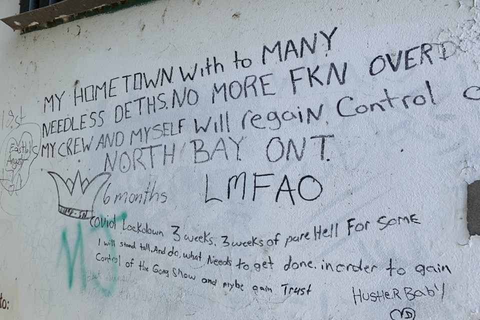 Graffiti about overdose deaths on a downtown North Bay wall.
