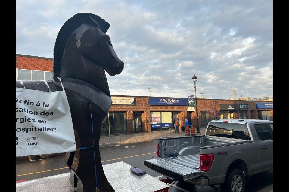 A 15-foot tall Trojan horse stands near the front doors of Nipissing MPP Vic Fedeli's constituency office in downtown North Bay.  Photo by Chris Dawson/BayToday. 