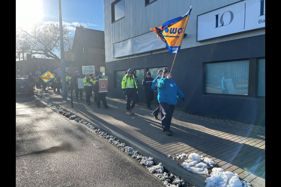 Postal workers marching up Main Street West to Nipissing-Timiskaming MP Anthony Rota's office. 