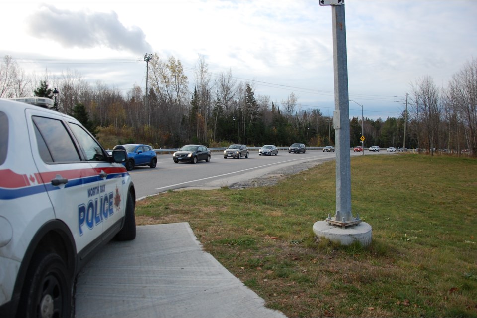 Cars line up to cross a picket line at Canadore. A vote has been ordered on suspending the strrike. Submitted.