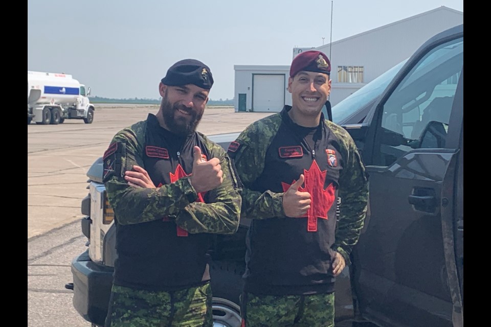 SkyHawks Master Corporal Maxime Dupont and Corporal Hugo Smith give the thumbs up to Armed forces day in North Bay.  Photo by Chris Dawson/BayToday. 