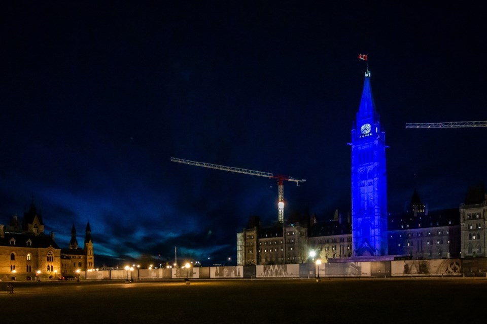 The Ottawa Peace Tower shines in blue on April 1, 2024, in recognition of the RCAF Centennial. The Peace Tower was among the 56 worldwide landmarks that counted towards the RCAF’s Guinness World Record for the number of landmarks illuminated in 24 hours.