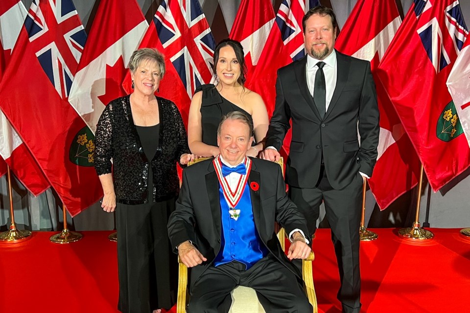 Jay Aspin (centre) surrounded by his family — wife Joanne and children Katie and David — following his investment into the Order of Ontario on Oct. 28, 2024.