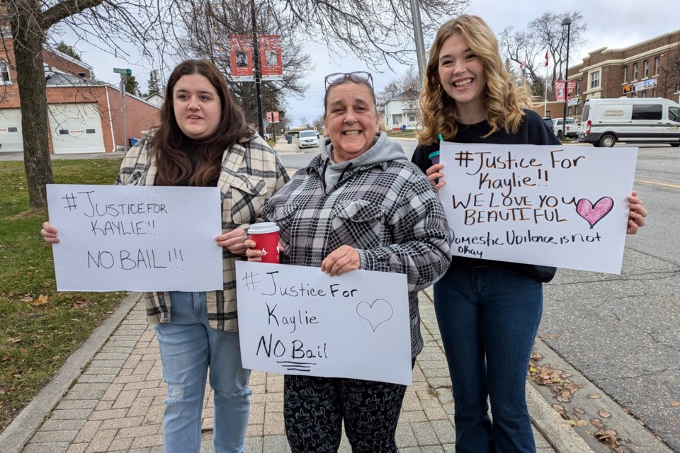 These Kennedy supporters of Kaylie Smith were out in full force in Haileybury and determined to put on a brave face for the Cobalt teen. From left: Kailey, Carol and Grace.