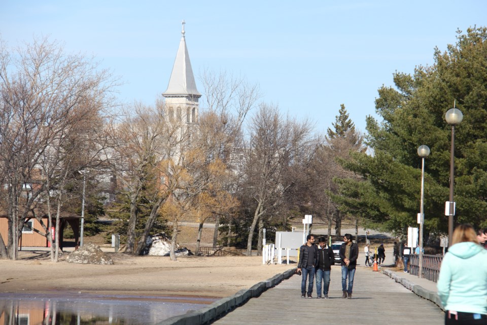 USED 170428 8 Strolling King's Landing. Pro Cathedral of the Assumption in the background. North Bay waterfront.Photo by Brenda Turl for BayToday