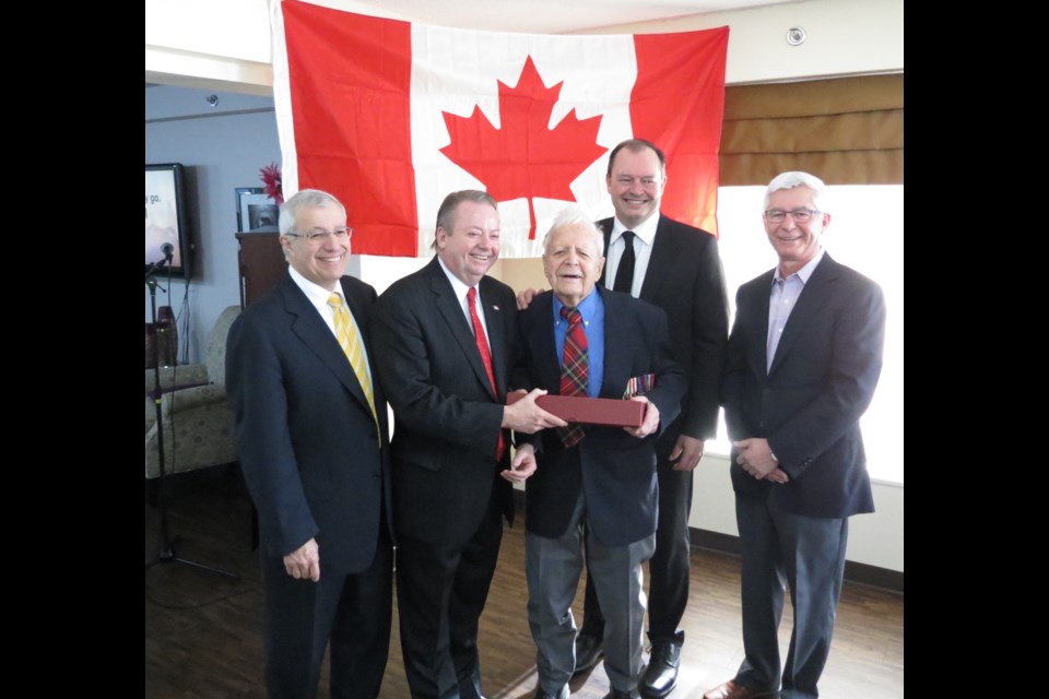 Bruce Goulet was honoured by Canada in 2015 for his service to the community. Here, at centre,  he is joined by MPP Vic Fedeli, MP Jay Aspin, Mayor Al McDonald and sone Paul Goulet.        