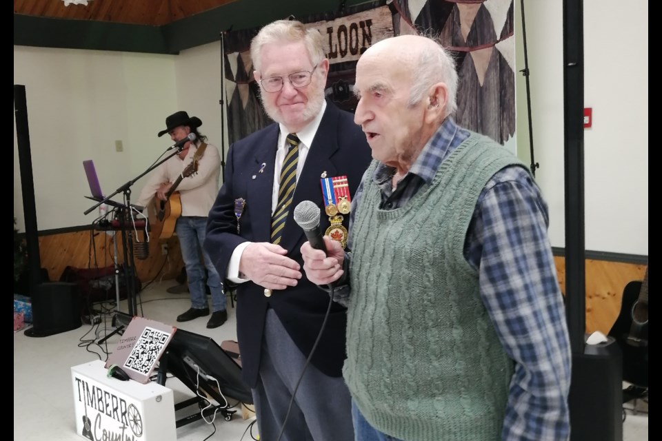 West Ferris Legion Br. 599 President Red Trowsdale, left, and Second World War veteran and farmer Bill Parfitt speak at his 100th birthday party held Saturday, Dec. 28.