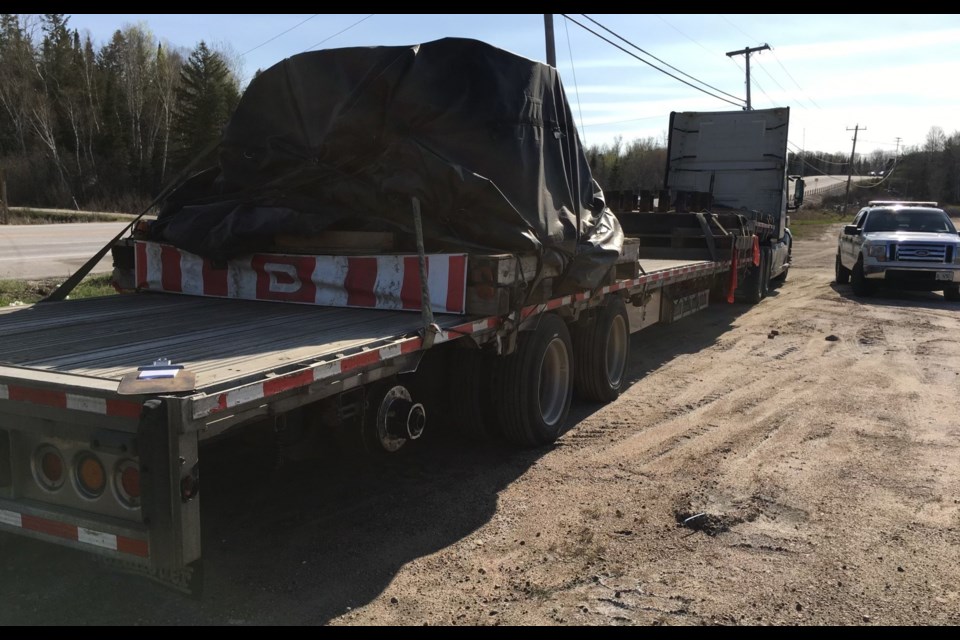 This transport was pulled over because of a missing tire