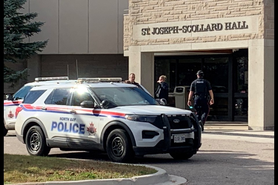 Police were out in full force today at St. Joseph Scollard Hall. A weapon was recovered and a person arrested.