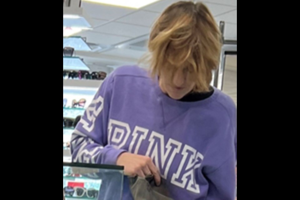 At the time of the robbery, she was wearing a purple sweater with the brand name “PINK” printed on the front and right sleeve in white lettering