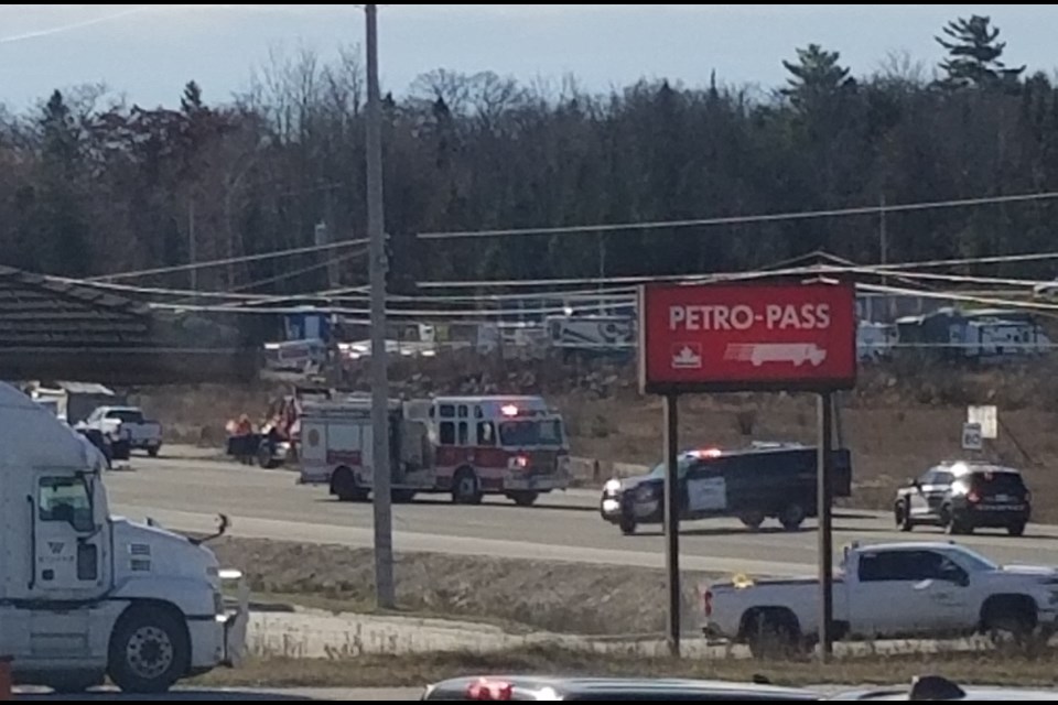 Highway 11 is closed just north of the city after a two-vehicle collision.