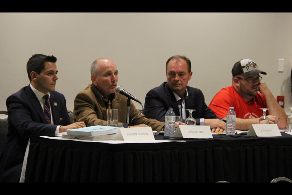 Sheldon Forgette, Gary Gardiner. Al McDonald and Will Boissoin take questions from the audience during Thuesday night's debate. Jeff Turl/BayToday.