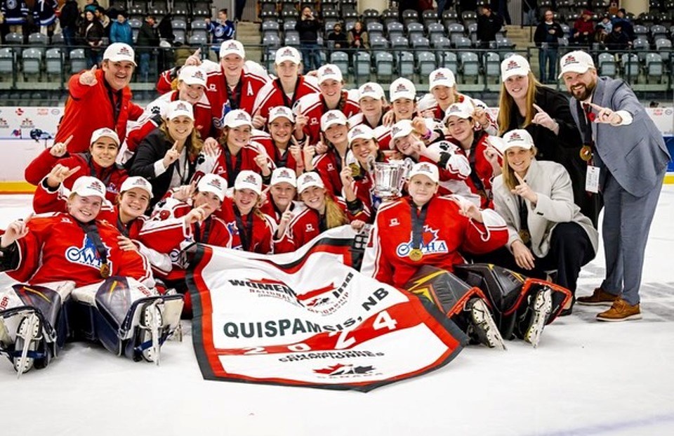 Jefferies and Butkevich (far right) celebrate with Team Ontario Red. Courtesy Hockey Canada. 