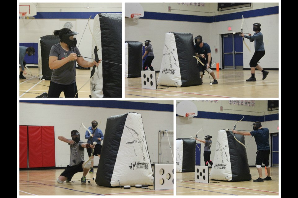 Players take cover to protect themselves while they take carefully aimed shots at targets and the opposing team. Photo by Ryen Veldhuis.