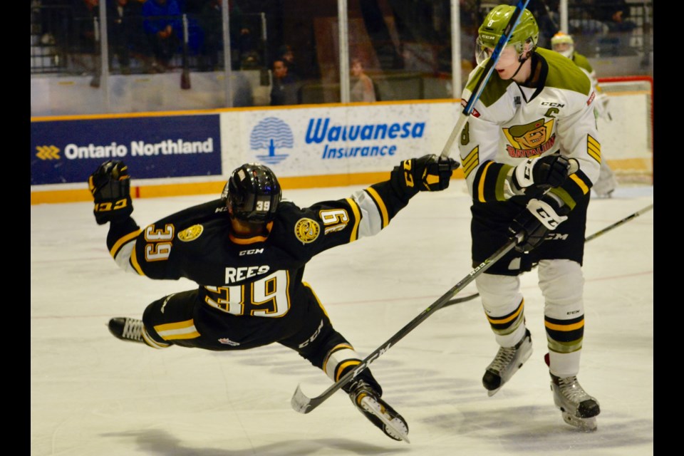 Riley Bruce asks Jamieson Rees: "Wanna go for a trip?"  Photo by Tom Martineau. 