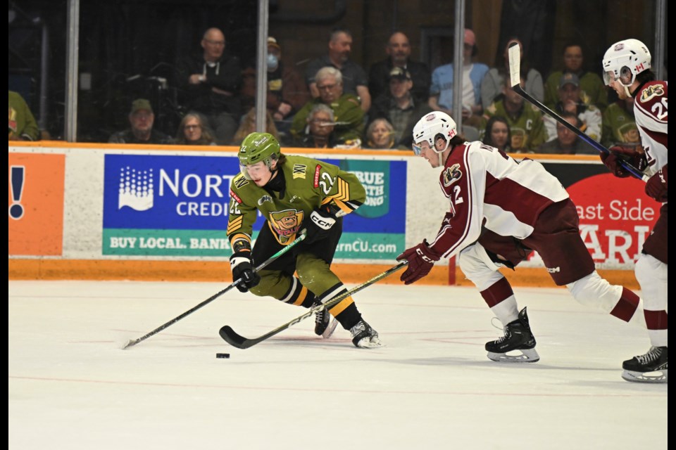 Matvey Petrov races with the puck in game one. Photo by Tom Martineau/Baytoday. 