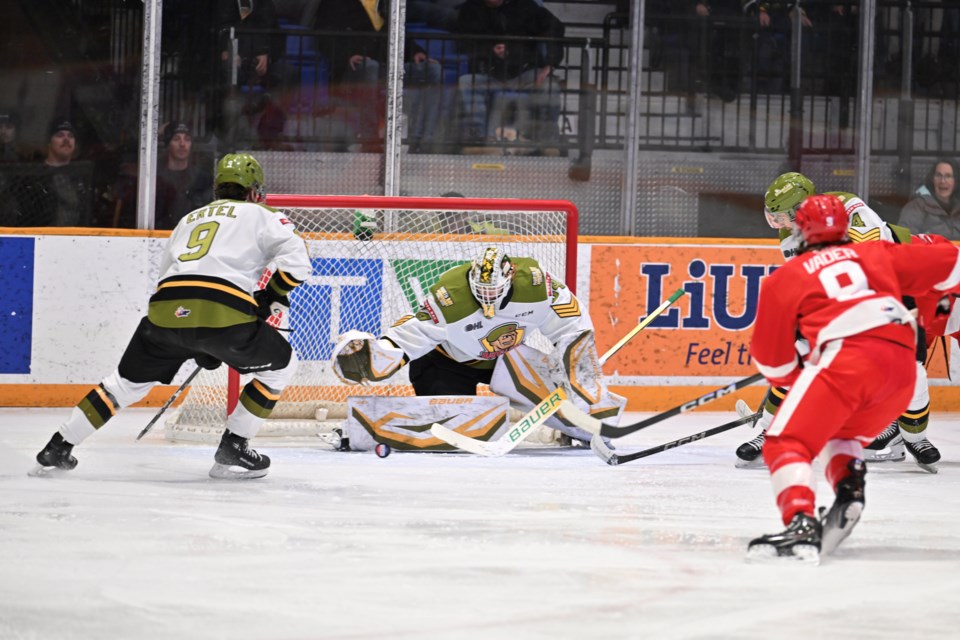 Mike McIvor makes a first period stop.  Photo by Tom Martineau/BayToday. 