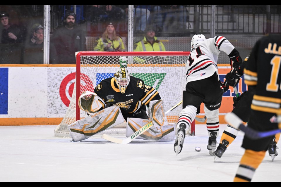 Battalion goalie Mike McIvor makes a first period save.  Photo by Tom Martineau/BayToday. 