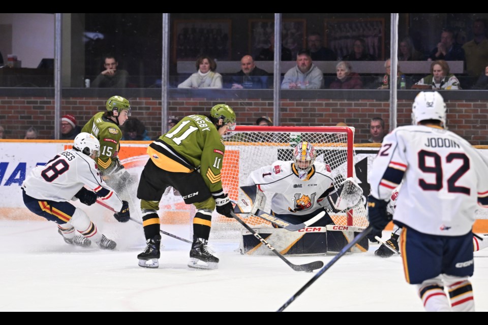 Liam Arnsby tries a nifty toe-drag move in front of the Barrie net. 