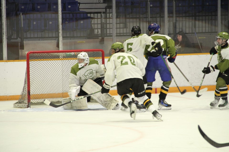 Action during the opening Green vs. White scrimmage at Memorial Gardens. 