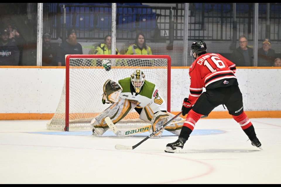 Mike McIvor prepares for a Jake Crawford shot against him in the shootout. 