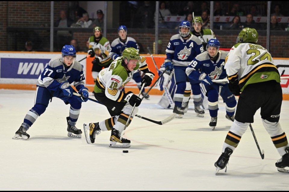 Jacob LeBlanc holds onto the puck.  Photo courtesy Tom Martineau. 