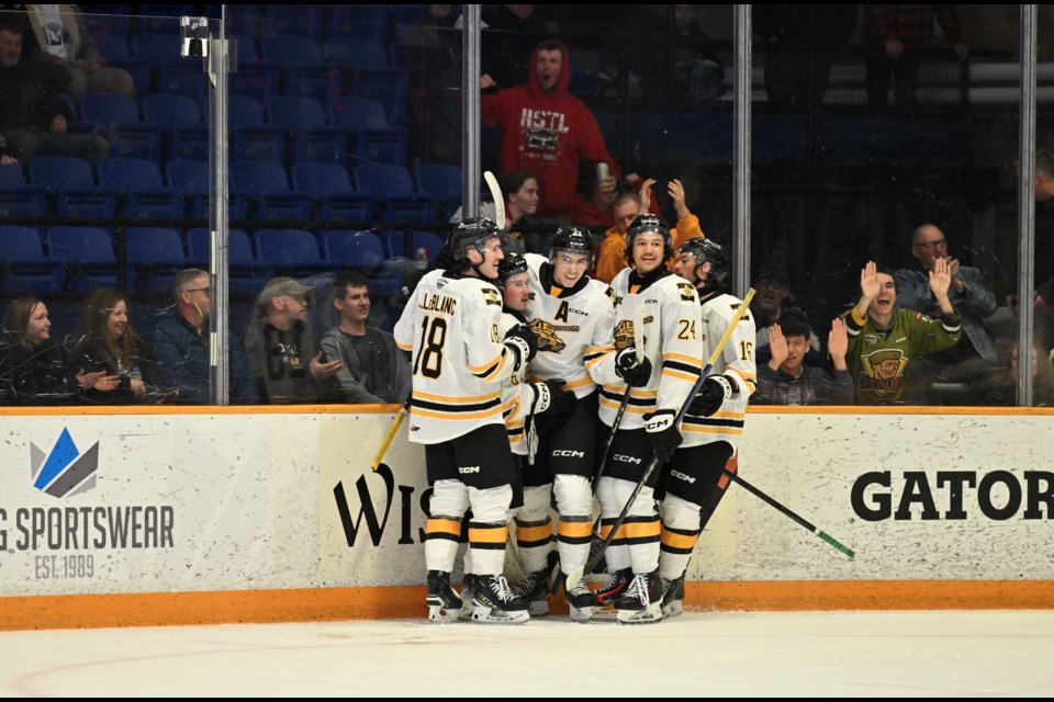 The Battalion celebrate Ethan Procyzsyn's third period goal against Guelph.