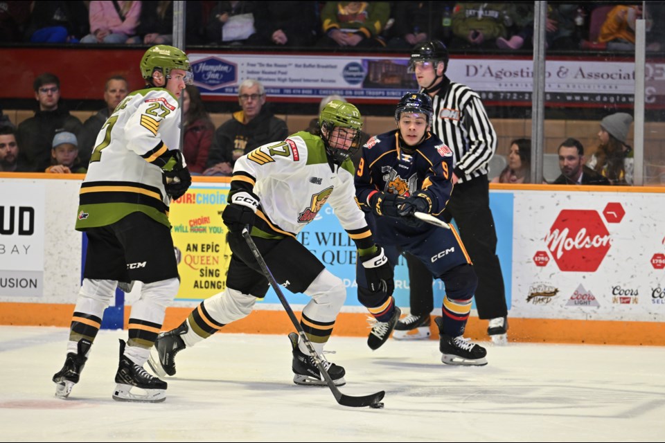 Battalion newcomer Ryder Cali with the puck in the neutral zone during first period action against the Barrie Colts. 