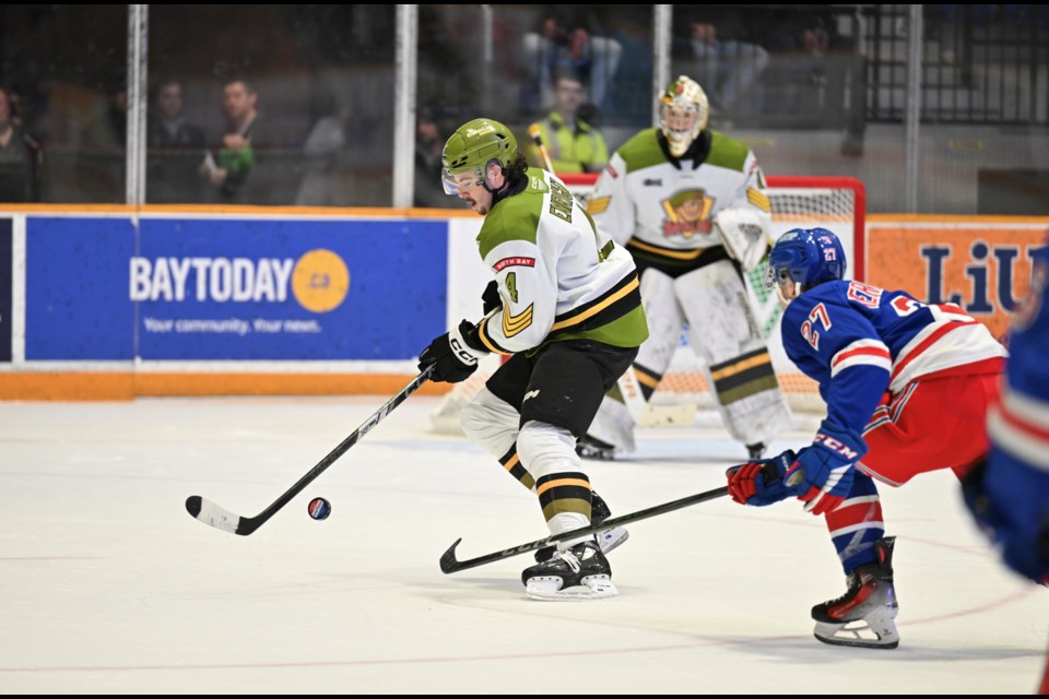 Aaron Enright settles the puck down.