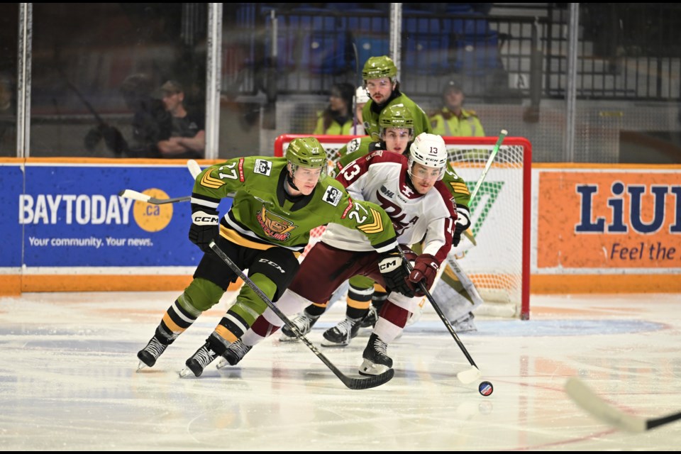 Andrew Leblanc battling for the puck during first period play. Tom Martineau/BayToday. 