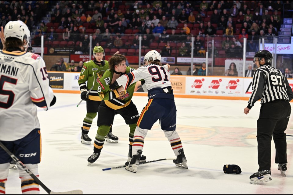 Parker Vaughan drops the gloves with former teammate Michael Derbidge. 