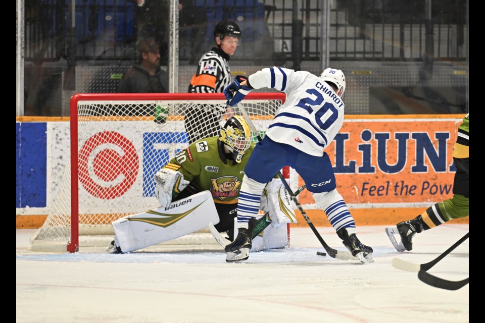 Battalion goalie Jack Lisson makes a key stop on Steelheads forward Gabriel Chiarot. 