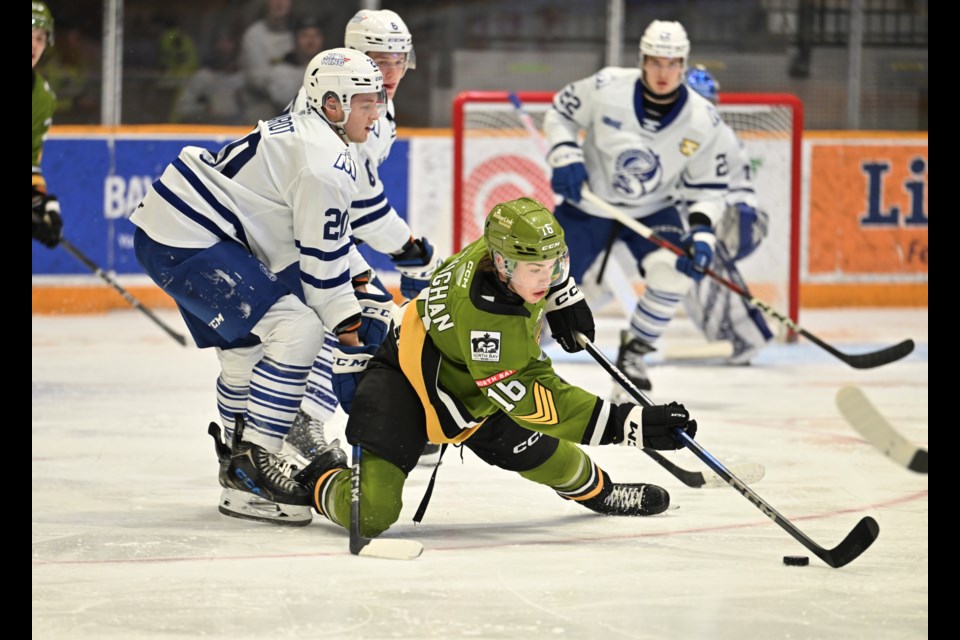 Parker Vaughan falls down but moves the puck against the Steelheads. 