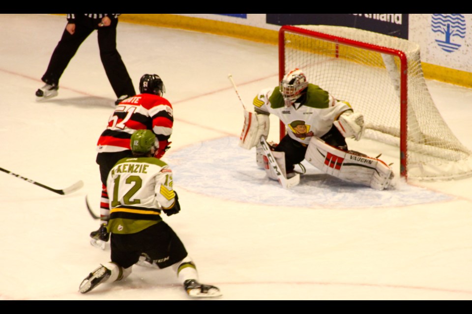 Julian Sime with a save on Drake Rymsha.  Photo by Chris Dawson