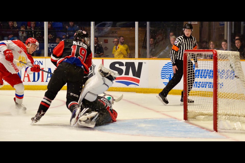 Former Battalion goaltender Evan Cormier makes a diving save versus Team Russia, Thursday. Photo by Tom Martineau.