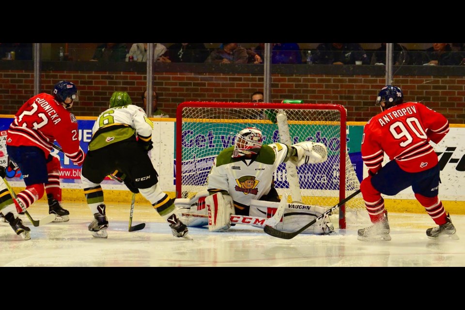 Julian Sime makes the save on Jack Studnicka of the Generals Wednesday night at Memorial Gardens. Photo by Tom Martineau.