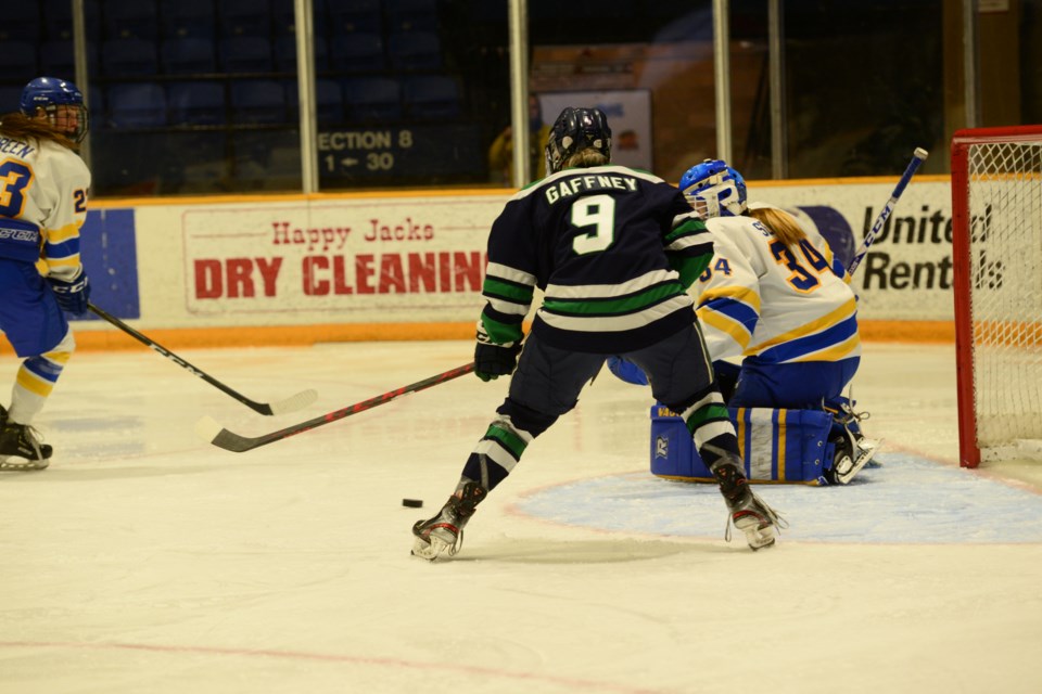 Lakers forward Brianna Gaffney waits for the puck just before scoring the eventual game winning goal as the Lakers defeat the Rams 3-1 in OUA playoff action. Photo by Brian Doherty. 