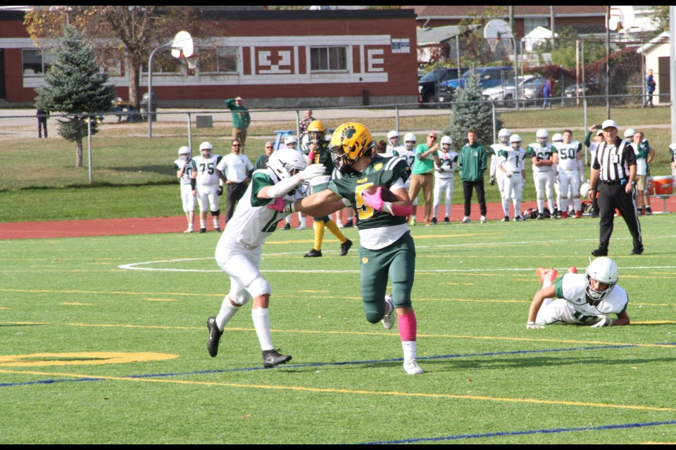 The Bears Anthony Backer tries to break a tackle. 