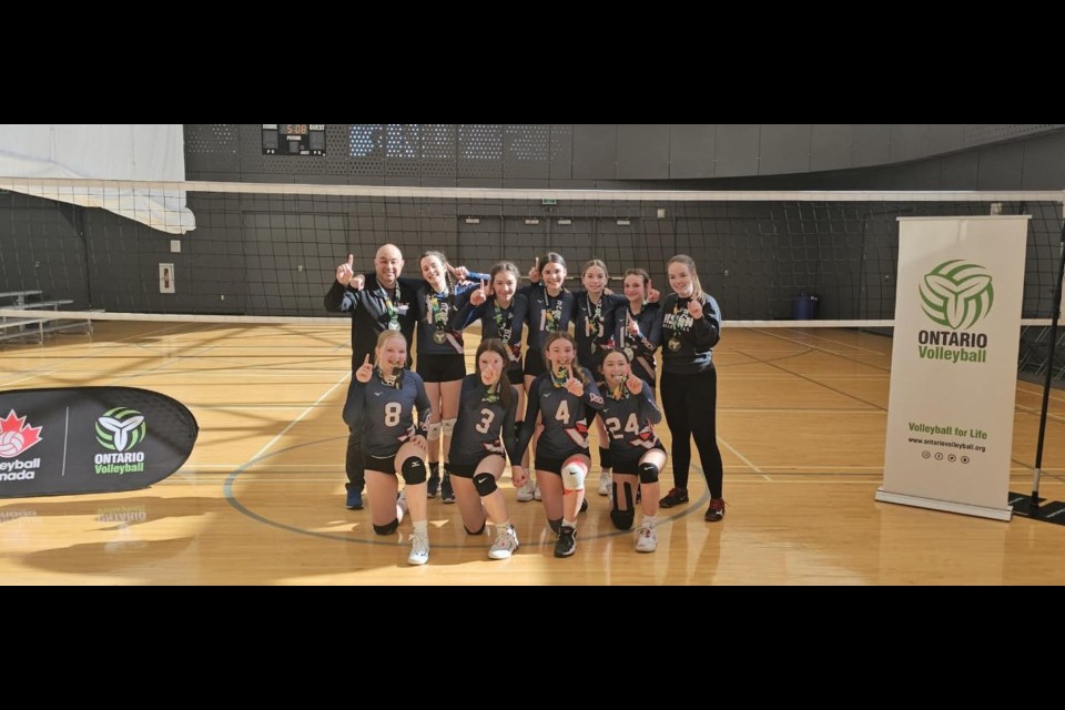 U14 Vision Sharks Volleyball celebrating their win in Waterloo.