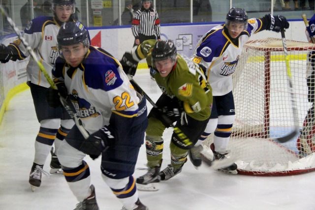 Parker Bowman tracks the puck in NOJHL action in Powassan, Sunday. The Voodoos won 5-1. Photo by Chris Dawson.